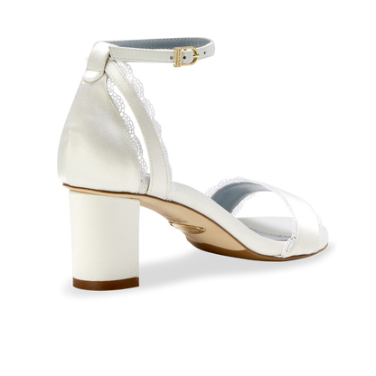 Stylish and comfortable, the Perfect Block Sandal 60 in Wedding White Satin features a 60mm block heel, arch support, and adjustable ankle straps.